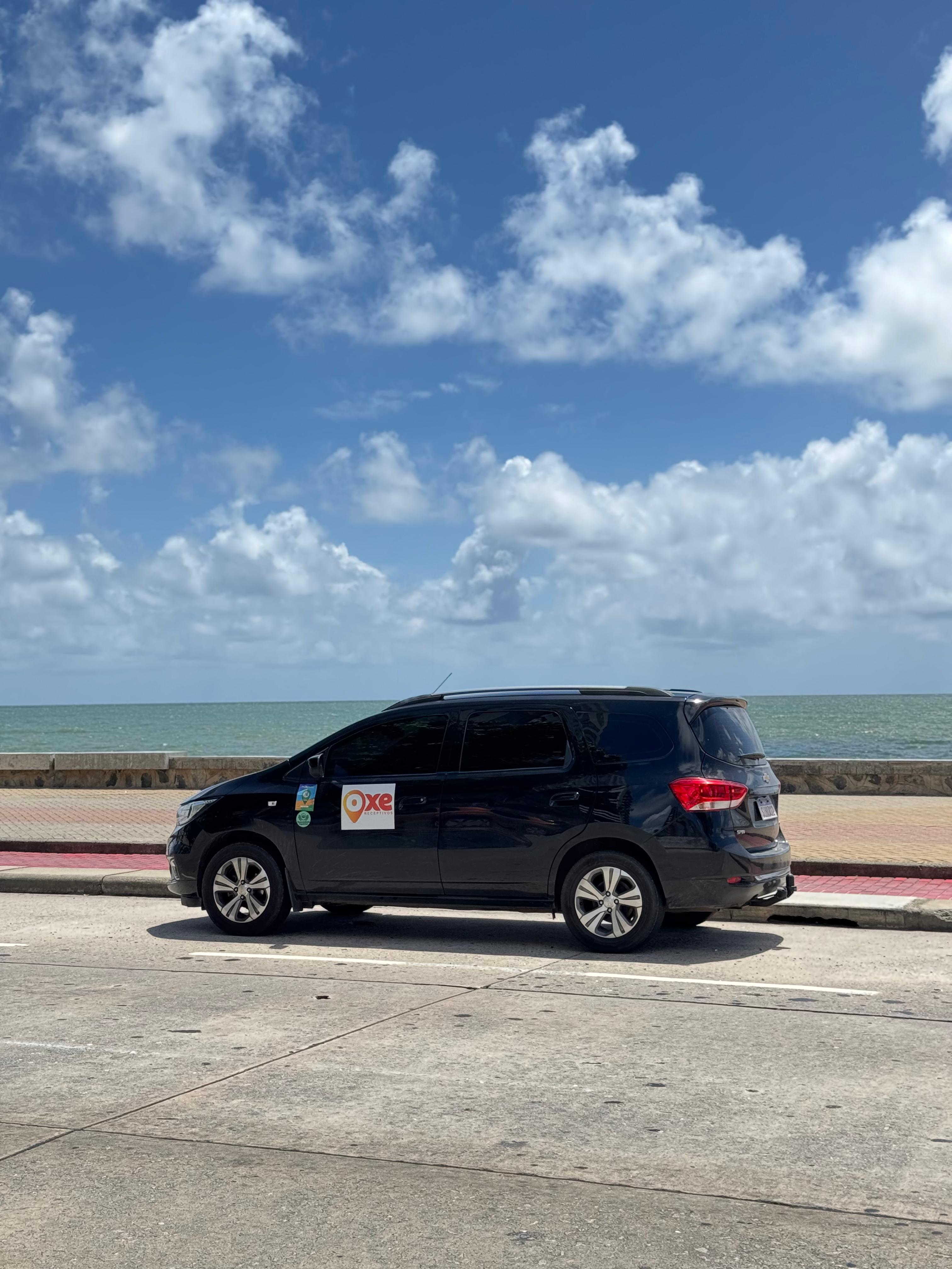 Carro da OXE na praia